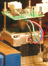 The electronics for controlling one valve of the compressed air hybrid engine.  The valve actuation position is controlled with a stepper motor. The PCB has a magnetic shaft encoder built in, with electronics to detect the shaft position and drive the stepper motor.  This controller communicates with a main ECU